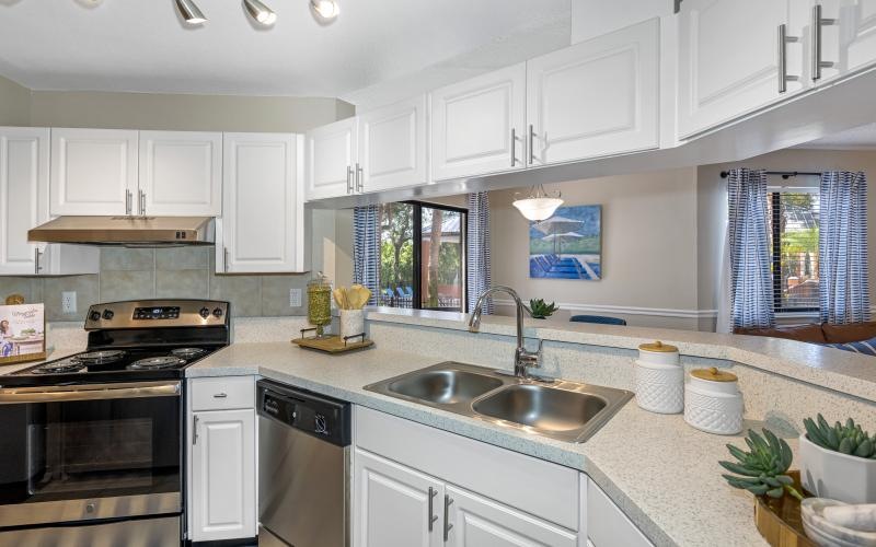 a kitchen with white cabinets